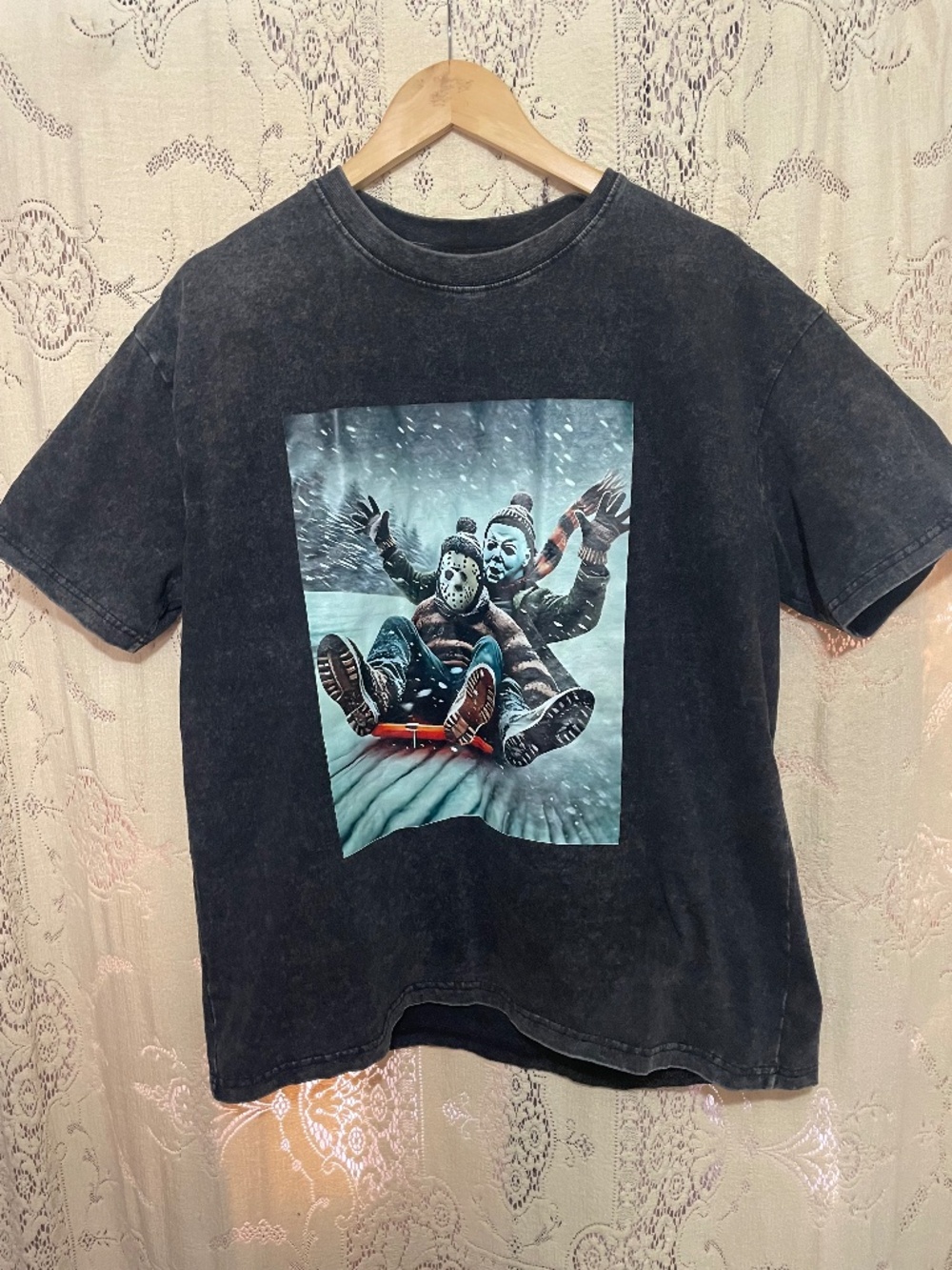 vintage-style black distressed t-shirt featuring a Christmas-themed horror shirt